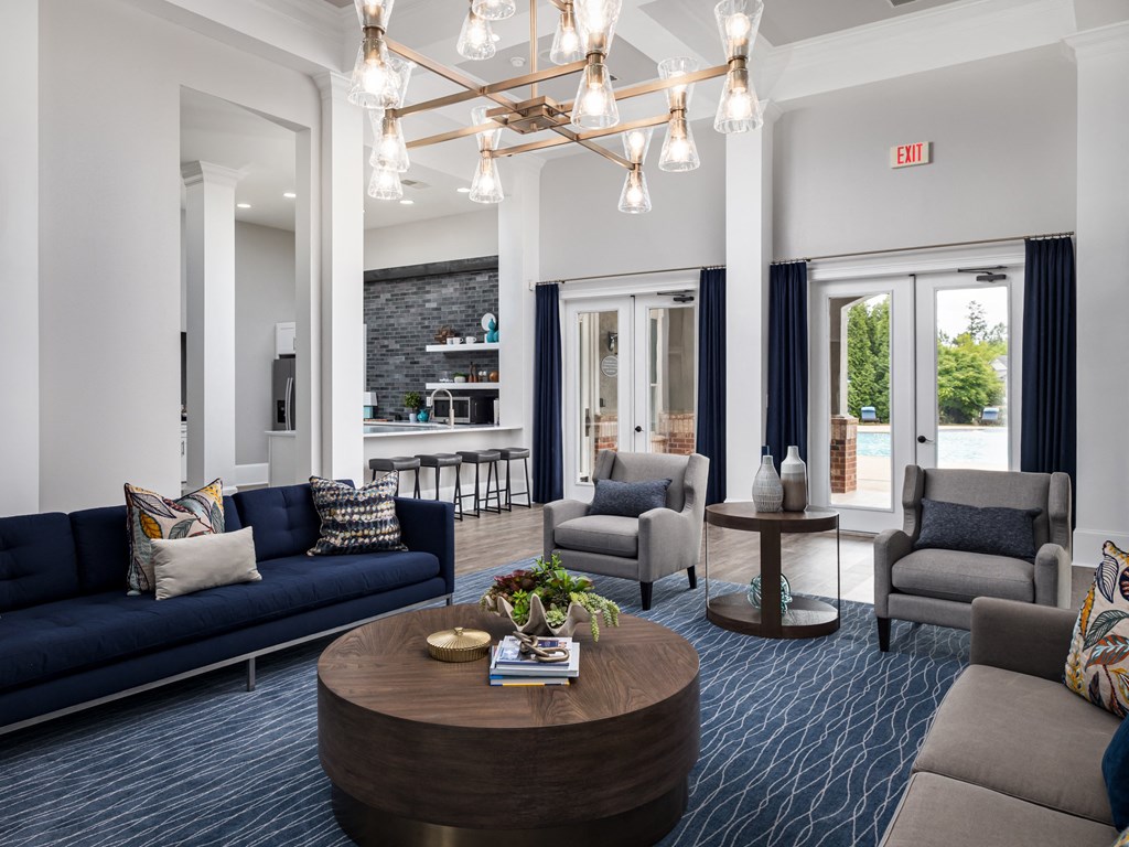a living room with couches and chairs and a coffee table