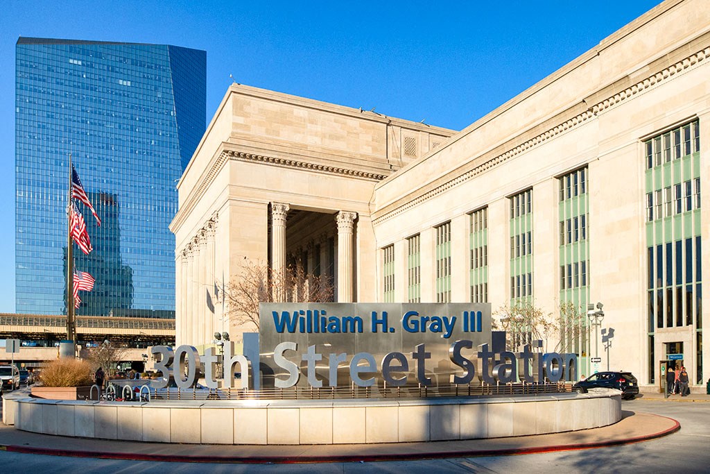 a large building with a street sign in front of it