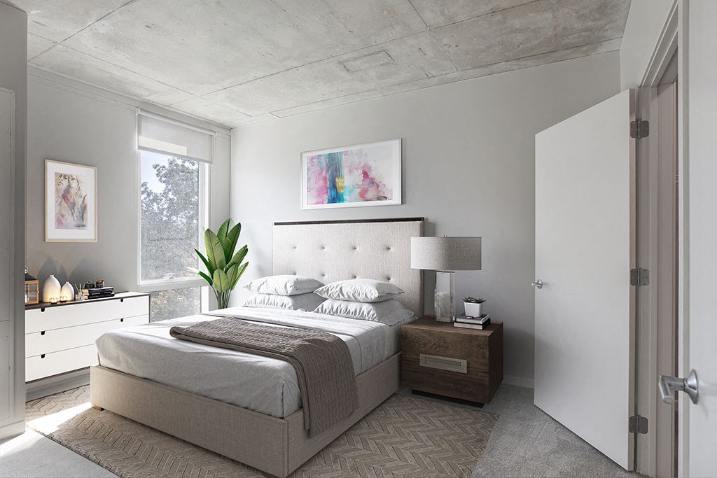 a bedroom with a bed and a dresser and a window