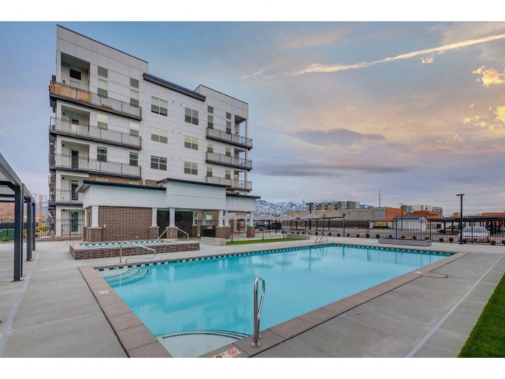 a swimming pool in front of a building