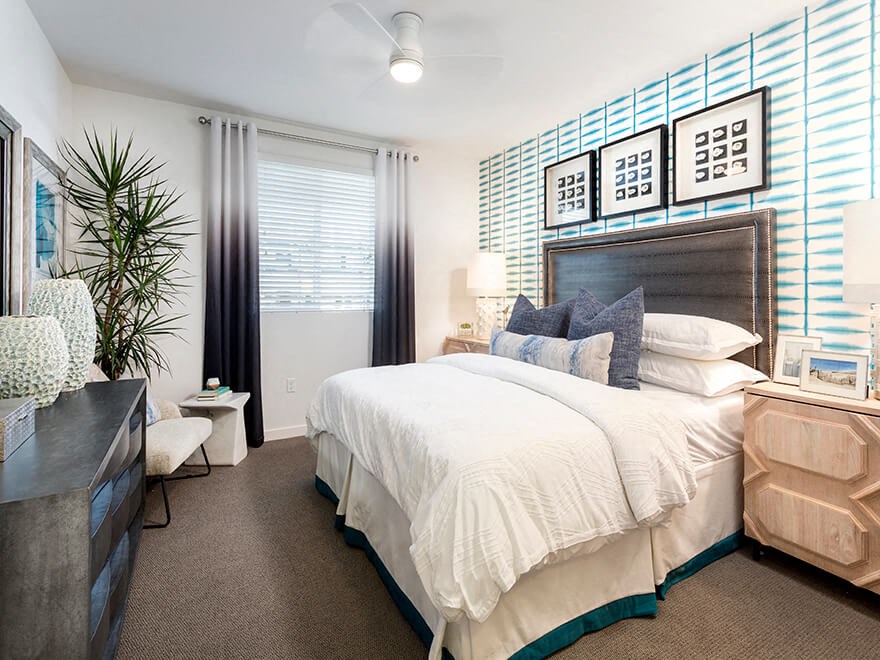 a bedroom with a bed and a dresser