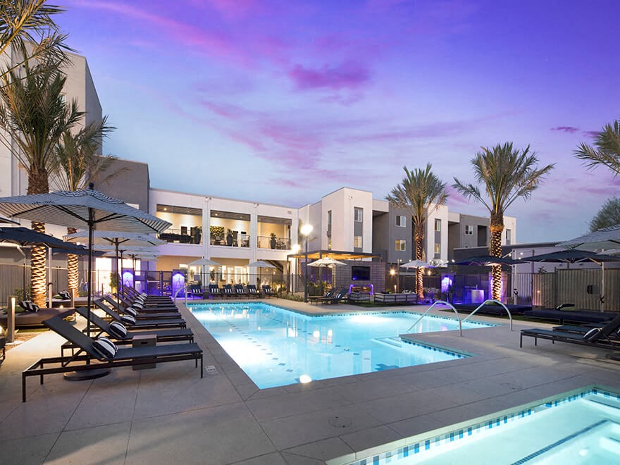 a swimming pool at night at the resort