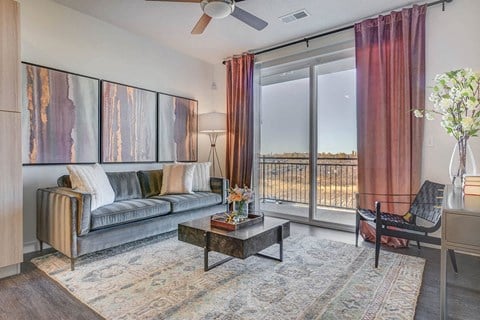 a living room with a couch and a sliding glass door