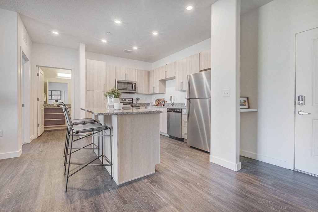 Kitchen- Stainless Steel Appliances, Hardwood floor, counter height island