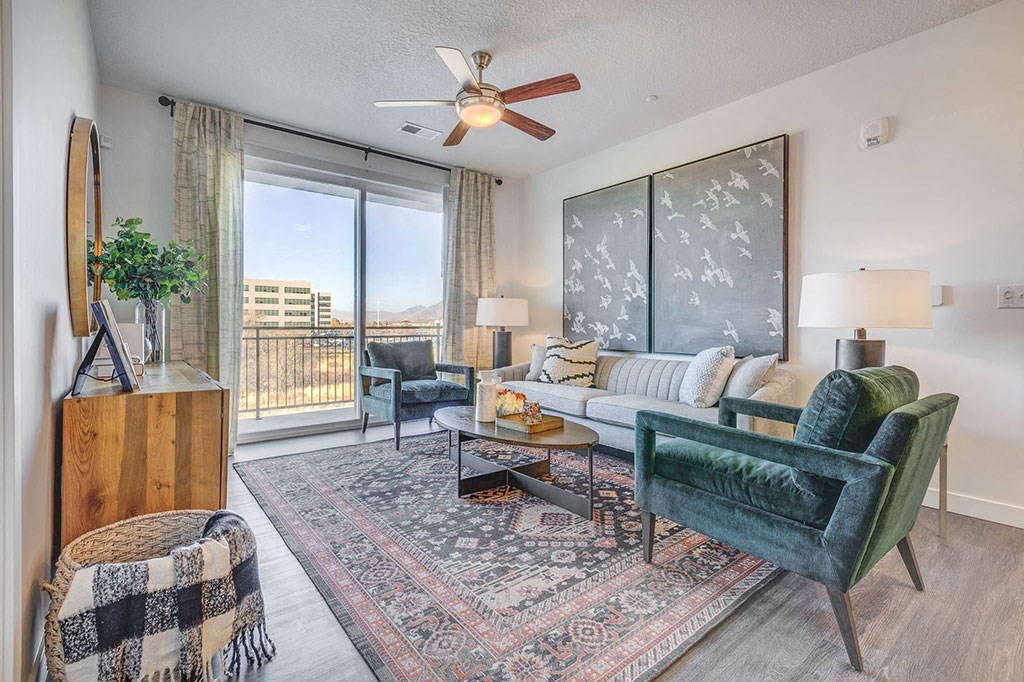 Furnished living room with hard floors and sliding glass door patio