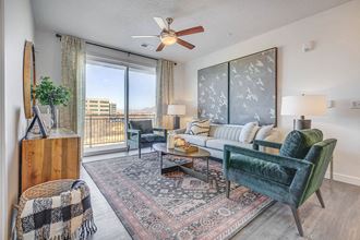 Furnished living room with hard floors and sliding glass door patio - Photo Gallery