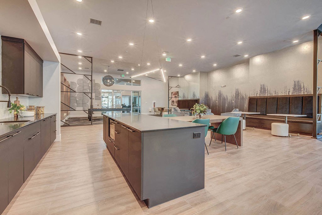 a large kitchen and dining area with a table and chairs