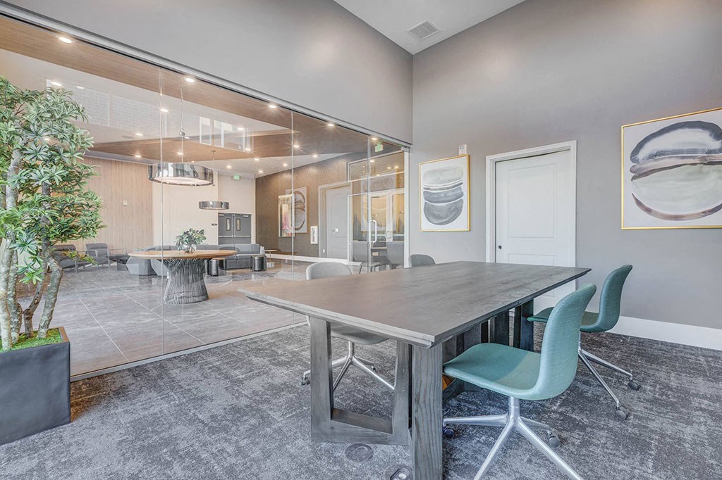 a conference room with a table and chairs
