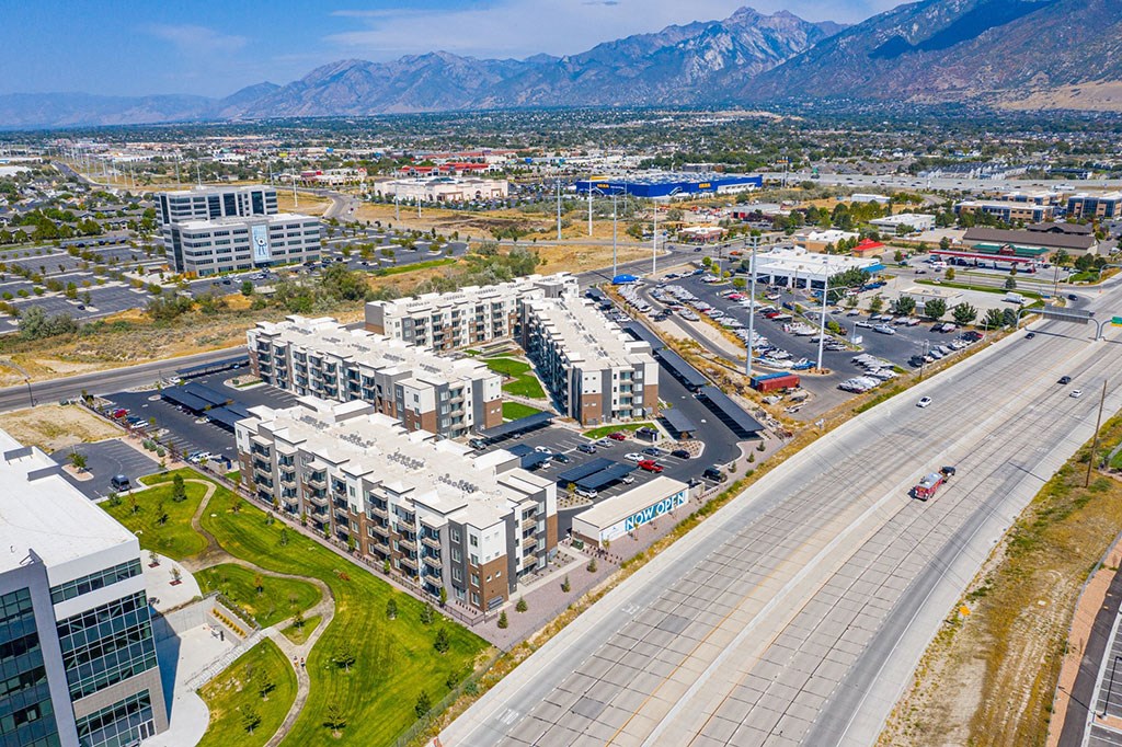 a aerial view of a city with buildings and a highway