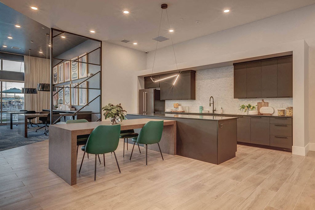 a kitchen and dining area with a table and chairs