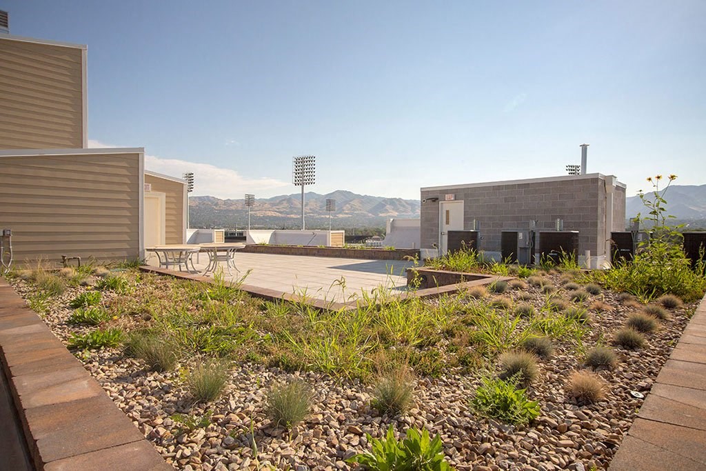 a backyard with a tennis court and buildings