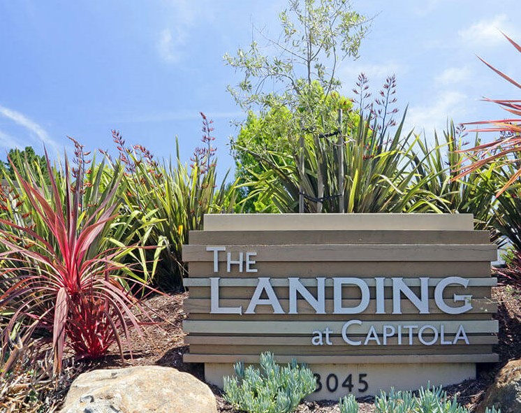 a sign at the landing at capitol commons