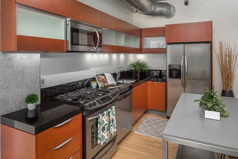 a kitchen with a stove and a refrigerator
