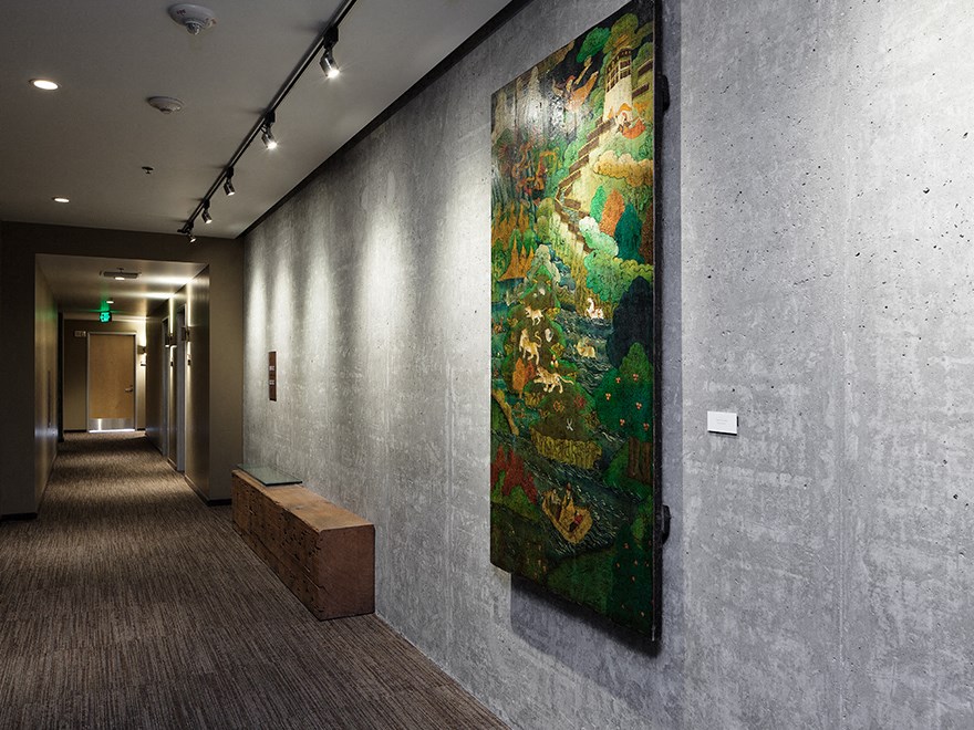 hallway with painting on wall at The Wyatt, Portland, 97209