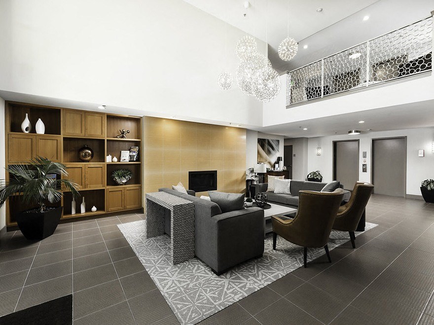 Lobby with seating area and fireplace at Axis, Seattle, 98109