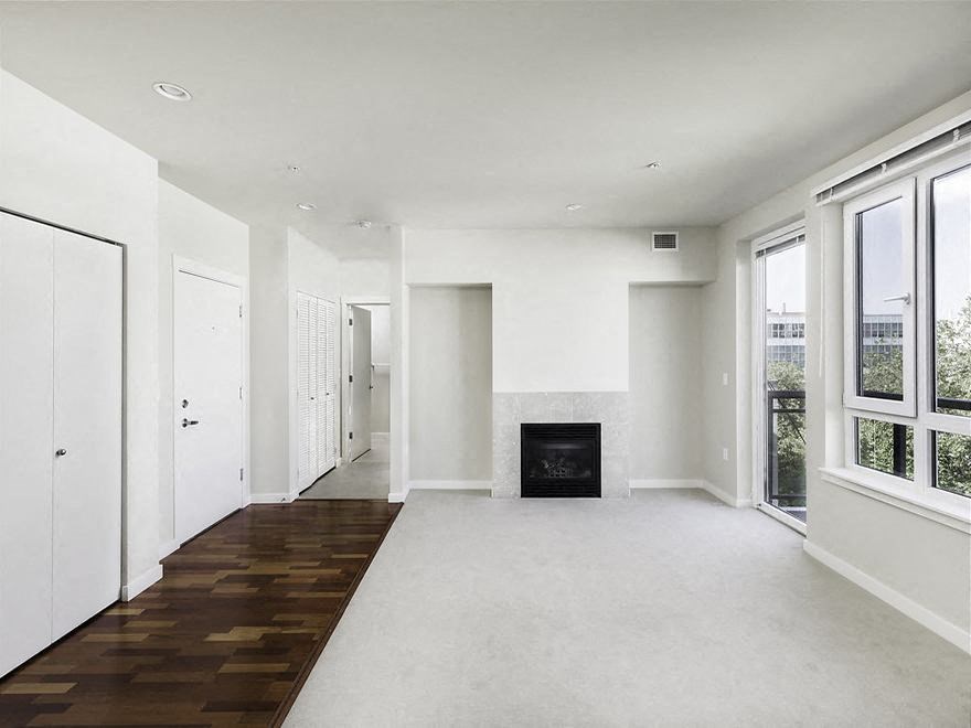 Vacant penthouse apartment home living room with fireplace at Axis, Seattle, 98109