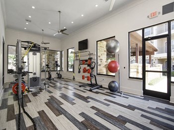 Fitness center with cardio equipment and weights - Photo Gallery 5