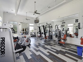 Fitness center with cardio equipment and weights - Photo Gallery 2