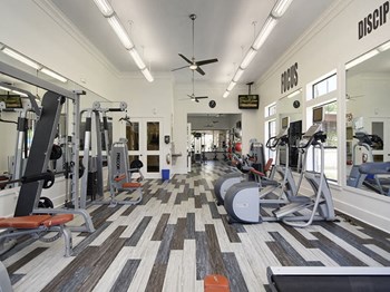 Fitness center with cardio equipment and weights - Photo Gallery 6
