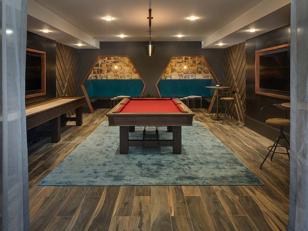 a billiards room with a pool table