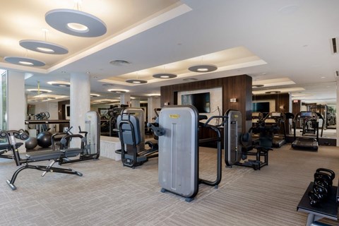 A fitness center with a variety of machines.