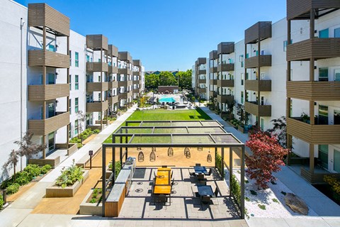 Outdoor space with community grill and pool