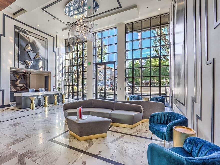 a living room with couches and chairs and a fireplace