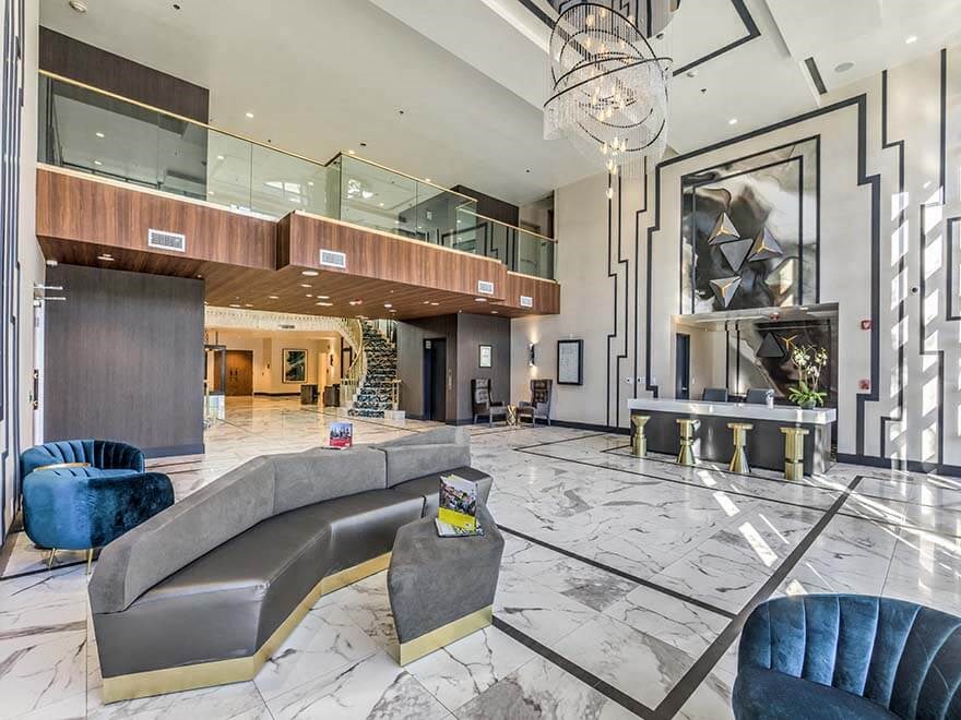 a large lobby with a couch and chairs