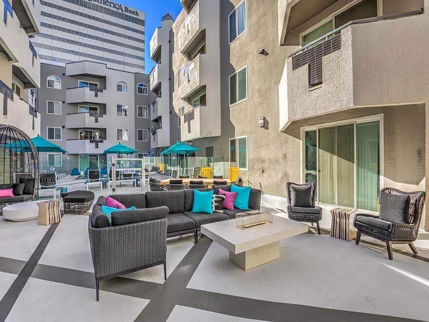 a living area with couches and chairs and a coffee table