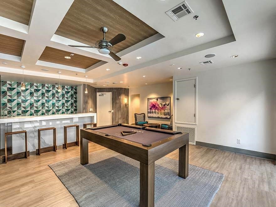 a game room with a pool table