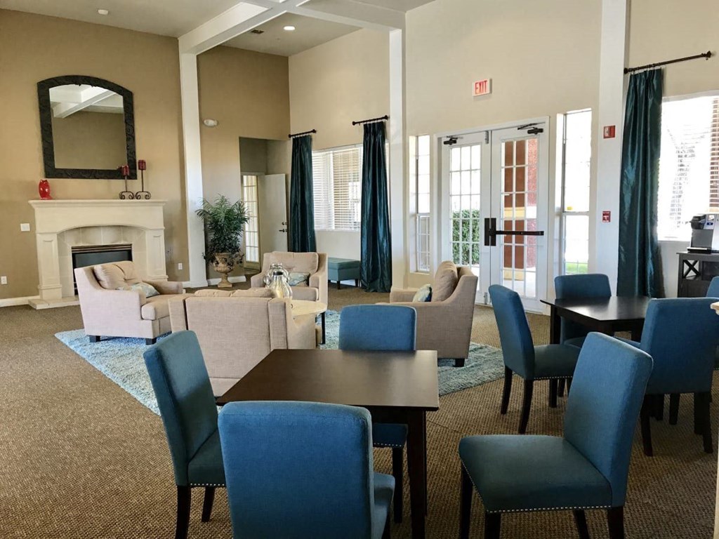 a living room with couches and chairs and a table