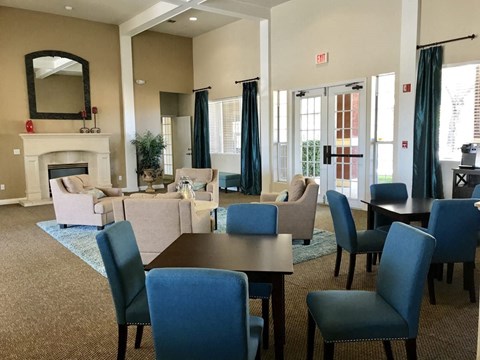 a living room with couches and chairs and a table