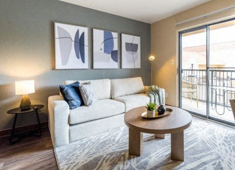 a living room with a white couch and a table