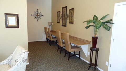 a dining room with a long table and chairs