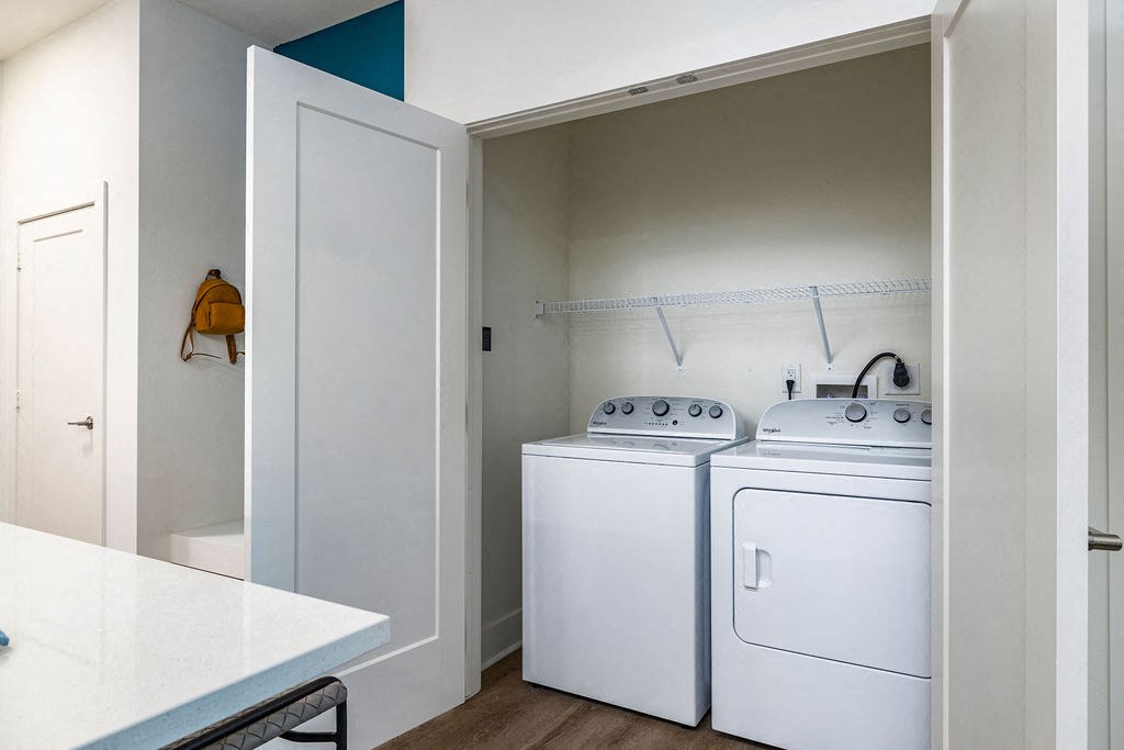 a laundry room with a washer and dryer
