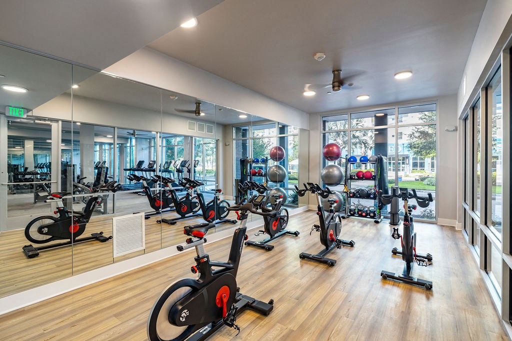 a gym with a lot of exercise equipment