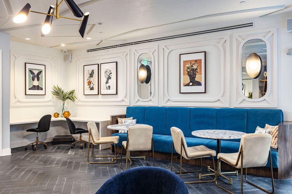 a room with a blue couch and white walls