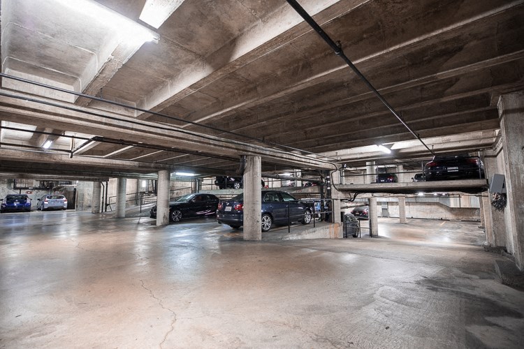 a parking garage with cars in it
