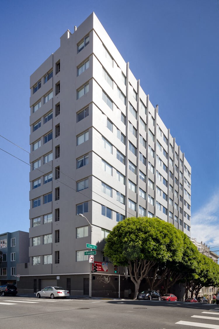 a white building with a blue sky in the background