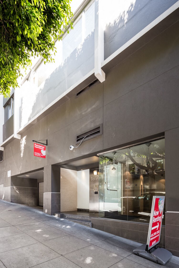 a building with a red sign in front of it