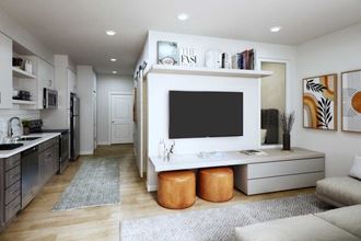 a living room with a television and a kitchen