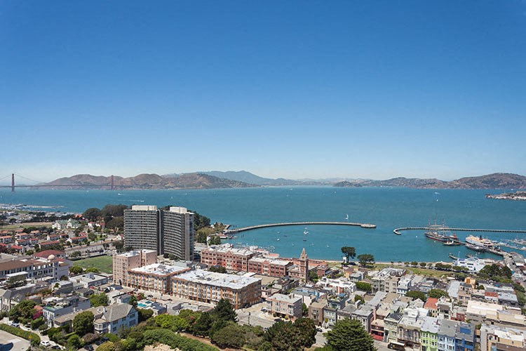 a view of the city of san francisco with the golden gate bridge in the background