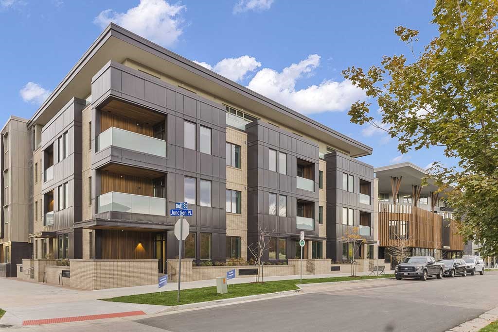 a building with a street sign in front of it