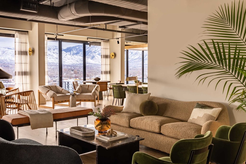 a living room filled with furniture and a large window