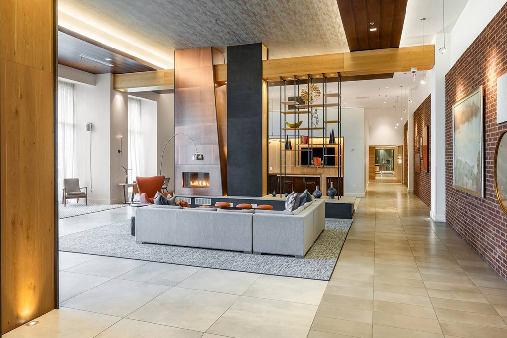 a living room filled with furniture and a fire place