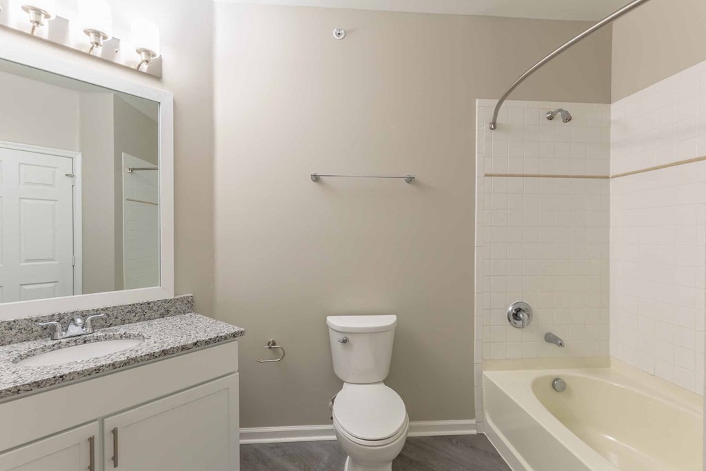 a bathroom with a toilet sink and bathtub