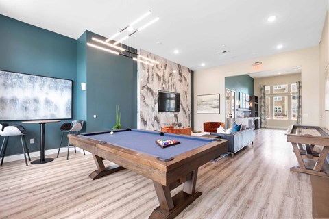 our apartments have a game room with a pool table and flat screen tv