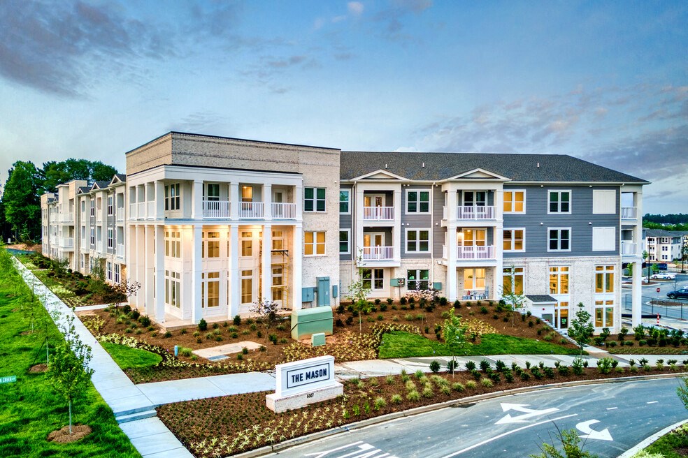 an aerial view of an apartment building at dusk