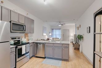 a kitchen with stainless steel appliances and a counter top
