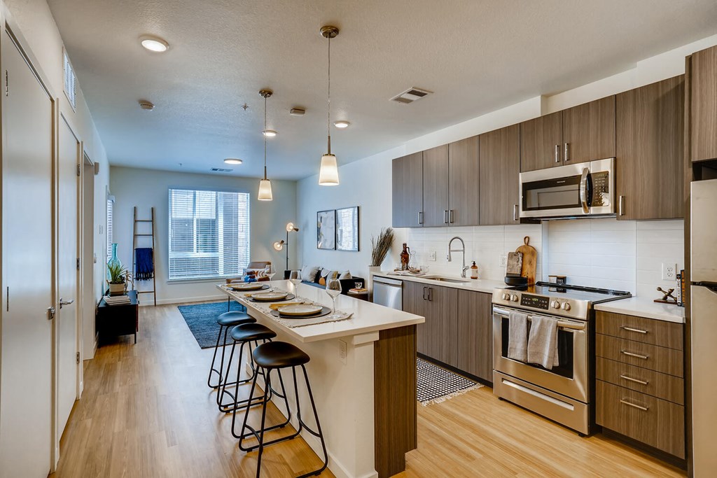 spacious kitchen with stainless steel appliances at the flats at obsidian